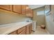 Bright laundry room with ample cabinetry and countertop space at 4730 Zeno Ct, Bradenton, FL 34211