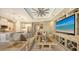 Open living area with large TV and access to pool and lanai at 4730 Zeno Ct, Bradenton, FL 34211