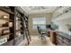 Home office with built-in shelving, desk, and window blinds at 4730 Zeno Ct, Bradenton, FL 34211