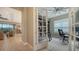 Home office with built-in shelving, French doors, and hardwood floors at 4730 Zeno Ct, Bradenton, FL 34211