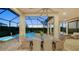 Covered patio with comfortable seating and a pool view at 4730 Zeno Ct, Bradenton, FL 34211