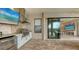 Stainless steel appliances and white cabinetry highlight this outdoor kitchen at 4730 Zeno Ct, Bradenton, FL 34211