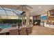 Outdoor kitchen features stainless steel appliances and granite countertops at 4730 Zeno Ct, Bradenton, FL 34211