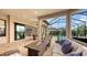 Covered patio with fire pit, seating, and views of the pool at 4730 Zeno Ct, Bradenton, FL 34211