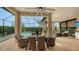Spacious patio with pool views, wicker furniture, and a dining table at 4730 Zeno Ct, Bradenton, FL 34211