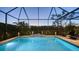 Relaxing screened pool area with a waterfall feature at 4730 Zeno Ct, Bradenton, FL 34211