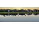 Stunning waterfront view of upscale homes reflecting on the lake at 4730 Zeno Ct, Bradenton, FL 34211