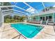 Inviting screened pool with paver deck at 780 Rellim Ln, Sarasota, FL 34232