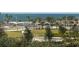 Waterfront property aerial view, featuring boats and lush green spaces at 800 N Tamiami Trl # 403, Sarasota, FL 34236