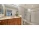 Clean bathroom with shower and wood vanity at 800 N Tamiami Trl # 403, Sarasota, FL 34236