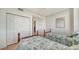 Bright bedroom with twin beds and hardwood floors at 800 N Tamiami Trl # 403, Sarasota, FL 34236