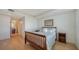 Guest bedroom with wood floors and built-in dresser at 800 N Tamiami Trl # 403, Sarasota, FL 34236
