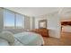 Light and airy bedroom with a view and wood floors at 800 N Tamiami Trl # 403, Sarasota, FL 34236