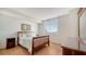 Bright bedroom with wood floors and large windows at 800 N Tamiami Trl # 403, Sarasota, FL 34236