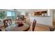 Dining area with a round table and chairs, open to living and kitchen areas at 800 N Tamiami Trl # 403, Sarasota, FL 34236