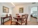 Charming dining area with a round table and four chairs at 800 N Tamiami Trl # 403, Sarasota, FL 34236