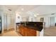 Modern kitchen with granite countertops and wood cabinets at 800 N Tamiami Trl # 403, Sarasota, FL 34236