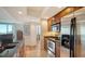 Stainless steel appliances and wood cabinets in this updated kitchen at 800 N Tamiami Trl # 403, Sarasota, FL 34236