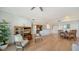 Open living space with hardwood floors, and a view into the kitchen and dining area at 800 N Tamiami Trl # 403, Sarasota, FL 34236