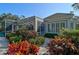 Landscaped backyard with lush greenery and a view of the pool area at 85 Sugar Mill Dr, Osprey, FL 34229