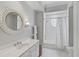 Charming bathroom with a white vanity, subway tile shower, and a window at 85 Sugar Mill Dr, Osprey, FL 34229