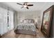 Serene bedroom with pool access, hardwood floors, and a large mirror at 85 Sugar Mill Dr, Osprey, FL 34229