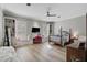 Bright bedroom with built-in window seats, hardwood floors, and a comfortable bed at 85 Sugar Mill Dr, Osprey, FL 34229