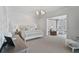 Main bedroom with sitting area and access to a private patio at 85 Sugar Mill Dr, Osprey, FL 34229