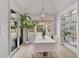 Bright dining room with pool view and built-in shelving at 85 Sugar Mill Dr, Osprey, FL 34229