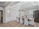 Elegant dining room with hardwood floors and a chandelier at 85 Sugar Mill Dr, Osprey, FL 34229