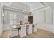Formal dining room, hardwood floors, chandelier, and built-in hutch at 85 Sugar Mill Dr, Osprey, FL 34229