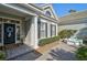 Inviting front entrance with a fountain and lush landscaping at 85 Sugar Mill Dr, Osprey, FL 34229