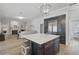 Gourmet kitchen with island, stainless steel appliances, and white cabinetry at 85 Sugar Mill Dr, Osprey, FL 34229