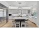 Spacious kitchen boasts a large island, stainless steel appliances, and white cabinets at 85 Sugar Mill Dr, Osprey, FL 34229