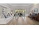 Spacious living room with hardwood floors and a view to the backyard at 85 Sugar Mill Dr, Osprey, FL 34229