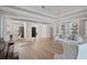 Open concept living area with hardwood floors and high ceilings at 85 Sugar Mill Dr, Osprey, FL 34229