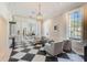 Lobby area with seating, checkerboard floors, and large windows at 85 Sugar Mill Dr, Osprey, FL 34229