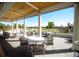 Outdoor patio with seating and golf course views at 85 Sugar Mill Dr, Osprey, FL 34229