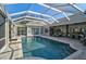 Resort-style pool and spa with a covered patio perfect for entertaining at 85 Sugar Mill Dr, Osprey, FL 34229