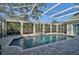 Large, refreshing pool with a spa, screened enclosure, and ample surrounding space at 85 Sugar Mill Dr, Osprey, FL 34229