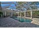 Inviting, screened-in pool with spa and plenty of space for lounging at 85 Sugar Mill Dr, Osprey, FL 34229