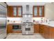 Modern kitchen with stainless steel appliances and wood cabinets at 915 Seaside Dr # 604, Sarasota, FL 34242