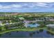 Community overview, including pool and lake at 12735 Aquamarine Ave, Bradenton, FL 34211