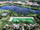 Two bocce ball courts nestled near a lake at 12735 Aquamarine Ave, Bradenton, FL 34211