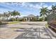 Gated community entrance with clubhouse view at 12735 Aquamarine Ave, Bradenton, FL 34211