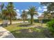 Relaxing community park with palm trees, hammock, and musical instrument at 12735 Aquamarine Ave, Bradenton, FL 34211