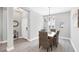 Charming dining room featuring a rustic wooden table and four chairs at 12735 Aquamarine Ave, Bradenton, FL 34211