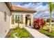 Inviting home exterior with landscaped walkway and lush greenery at 12735 Aquamarine Ave, Bradenton, FL 34211