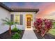 Inviting front door entrance with lush landscaping and a walkway at 12735 Aquamarine Ave, Bradenton, FL 34211