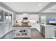 Modern kitchen with white cabinets, island, and stainless steel appliances at 12735 Aquamarine Ave, Bradenton, FL 34211